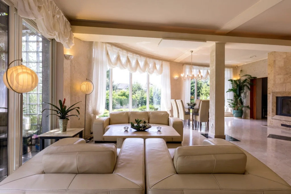 Elegant open-concept living and dining area with large windows and natural light.